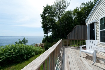 the oceanfront cottage deck and water view 