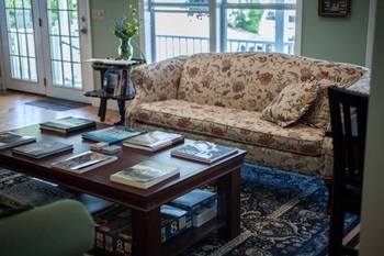 the wood table and couch in lobby