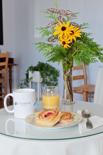 sunflowers on the table with continental breakfast