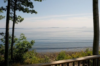 sitting on the porch looking at the water