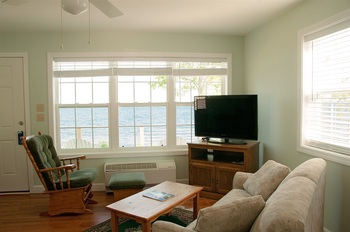 ENTERTAINING ROOM WITH TV COUCHES AND COFFEE TABLE