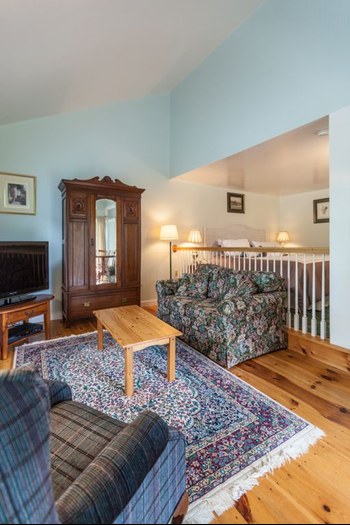 INTERIOR OF A COZY LOOKING LIVING ROOM 